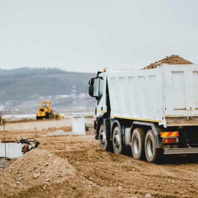 ml-and-associates-geotechnical-engineers-industrial-dumper-trucks-working-on-highway-constrtruction-foundation-investigation-infrastructure-development